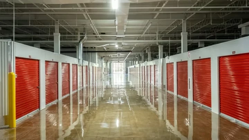 Wide lanes inside drive thru storage. medium storage units with red doors